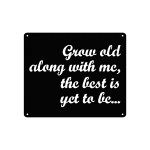 A square wall sign made of matte black steel, featuring the phrase 'Grow old along with me, the best is yet to be...' in elegant, cursive letters. The sign has precision cutouts and small holes in each corner for easy hanging, set against a plain white background.